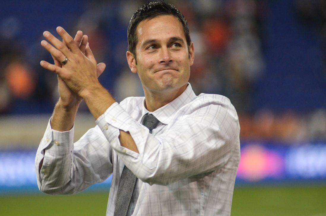 Mike Petke acknowledges the crowd after his team's victory.